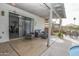 Relaxing covered patio with comfortable seating, adjacent to the pool area and indoor dining at 4434 W Dahlia Dr, Glendale, AZ 85304