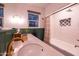 Stylish bathroom featuring a sleek white countertop, modern fixtures, and a classic subway tile shower at 45 W Edgemont Ave, Phoenix, AZ 85003