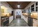 Spacious kitchen with stainless steel appliances, stone countertops, and an adjacent dining area with natural light at 45 W Edgemont Ave, Phoenix, AZ 85003