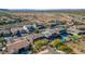 An overhead shot displays backyard pools, covered patios, and neighborhood scenery in this desert community at 4624 W Heyerdahl Ct, New River, AZ 85087