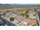Wide aerial shot showcases the neighborhood, nearby desert landscape and potential pool at 4624 W Heyerdahl Ct, New River, AZ 85087