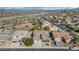 Wide aerial shot features the neighborhood and surrounding desert with mountain views in the distance at 4624 W Heyerdahl Ct, New River, AZ 85087