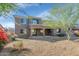The backyard features a covered patio, low-maintenance landscaping, and a view of the home's exterior at 4624 W Heyerdahl Ct, New River, AZ 85087
