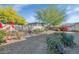 The backyard offers privacy with a block wall, desert vegetation, and a gravel landscape design at 4624 W Heyerdahl Ct, New River, AZ 85087