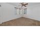 Bedroom featuring neutral carpet, ceiling fan, and window with blinds at 4624 W Heyerdahl Ct, New River, AZ 85087