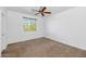 Bedroom featuring carpet, ceiling fan, and a bright window at 4624 W Heyerdahl Ct, New River, AZ 85087