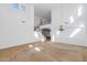 Open-concept living area with high ceilings, a staircase, and natural light creates a grand atmosphere at 4624 W Heyerdahl Ct, New River, AZ 85087