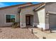 Exterior view of the front door with decorative stonework and a custom door at 5048 S Dante --, Mesa, AZ 85212