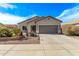 Charming home featuring a three-car garage and an immaculate lawn at 5048 S Dante --, Mesa, AZ 85212