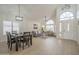 Bright living room with vaulted ceilings, modern furnishings, and a large arched window at 5246 E Enrose St, Mesa, AZ 85205