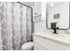 Bathroom with a shower, white cabinets, a toilet and white walls at 5725 E Colby St, Mesa, AZ 85205