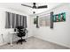 Bedroom featuring an office setup, a gray carpet, and a ceiling fan at 5725 E Colby St, Mesa, AZ 85205