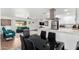Spacious open-concept living area features hardwood floors, modern furnishings, and an open kitchen at 5725 E Colby St, Mesa, AZ 85205