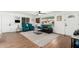 Inviting living room with hardwood floors, comfortable seating, a large window, and neutral décor at 5725 E Colby St, Mesa, AZ 85205
