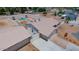 Aerial view of the property with a pool, garage, and well-maintained landscaping at 6020 E Shea Blvd, Scottsdale, AZ 85254