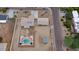 Aerial view showcasing the home's layout, detached garage, large lot and swimming pool at 6020 E Shea Blvd, Scottsdale, AZ 85254