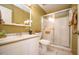 Well-lit bathroom with a white vanity, updated fixtures, and a shower over the bathtub at 6020 E Shea Blvd, Scottsdale, AZ 85254