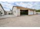 Large garage with open doors, spacious concrete area, and a clean exterior at 6020 E Shea Blvd, Scottsdale, AZ 85254