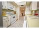 Well-lit kitchen with white appliances and ample counter space, offering functionality and style at 6020 E Shea Blvd, Scottsdale, AZ 85254