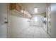 Functional laundry room featuring upper cabinets and included washer and dryer hookups at 6020 E Shea Blvd, Scottsdale, AZ 85254