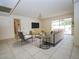 Cozy living room features modern furniture, a flat-screen TV, and access to an outdoor patio at 6020 E Shea Blvd, Scottsdale, AZ 85254