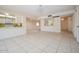 Open-concept living space featuring tile floors, modern lighting and seamless flow to kitchen at 6020 E Shea Blvd, Scottsdale, AZ 85254