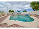 Refreshing in-ground pool with waterfall feature and lounge seating, perfect for relaxation at 6020 E Shea Blvd, Scottsdale, AZ 85254