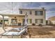 Spacious backyard features a patio, lounge chairs and a mature shade tree at 6614 E Portia St, Mesa, AZ 85215