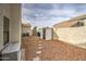 Low maintenance backyard with storage shed and decorative stone at 6614 E Portia St, Mesa, AZ 85215