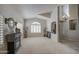 Bright living room featuring plantation shutters and neutral paint at 6614 E Portia St, Mesa, AZ 85215