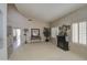 Open living room featuring plush carpeting, ample natural light, and an elegant decorative fireplace at 6614 E Portia St, Mesa, AZ 85215