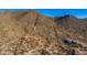Scenic view of a mountain and desert landscape with homes below at 6614 E Portia St, Mesa, AZ 85215