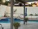 Backyard pool with spa framed with tiled border and desert landscaping at 6614 E Portia St, Mesa, AZ 85215
