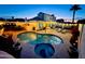 Backyard pool featuring spa, lounge chairs, outdoor seating, and string lights for ambiance at 6614 E Portia St, Mesa, AZ 85215