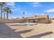 Large backyard with a kidney-shaped pool, patio area, and low-maintenance desert landscaping at 6913 E Kings Ave, Scottsdale, AZ 85254