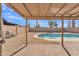 Covered patio view of a backyard oasis, showcasing a refreshing pool and desert landscaping at 6913 E Kings Ave, Scottsdale, AZ 85254
