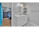 Bathroom with white vanity, modern fixtures, marble floors and bedroom access at 6913 E Kings Ave, Scottsdale, AZ 85254