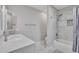 Well-lit bathroom showcasing marble floors and shower, a white vanity, and modern fixtures at 6913 E Kings Ave, Scottsdale, AZ 85254