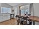 Cozy dining area with wood table, stainless steel appliances, and views of the outdoor pool at 6913 E Kings Ave, Scottsdale, AZ 85254