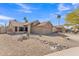 Charming single-story home with desert landscaping, a two-car garage, and well-maintained curb appeal at 6913 E Kings Ave, Scottsdale, AZ 85254