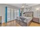Inviting main bedroom with sliding door, wood-style flooring, and modern decor at 6913 E Kings Ave, Scottsdale, AZ 85254