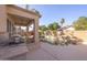 Outdoor kitchen and entertaining space overlooking the pool at 7452 W Los Gatos Dr, Glendale, AZ 85310