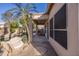 Backyard patio with desert landscaping, palm trees and view of the free form pool at 7452 W Los Gatos Dr, Glendale, AZ 85310