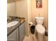 Cozy bathroom features granite countertops, tiled floors, and a modern toilet at 7452 W Los Gatos Dr, Glendale, AZ 85310