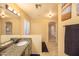 Large bathroom area featuring double vanity and bath tub at 7452 W Los Gatos Dr, Glendale, AZ 85310