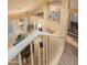 View from the stairs with a view into the dining and living areas at 7452 W Los Gatos Dr, Glendale, AZ 85310