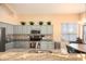 Beautiful kitchen featuring granite countertops, stainless steel appliances, and painted cabinets at 7452 W Los Gatos Dr, Glendale, AZ 85310