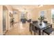 Inviting living room featuring a high ceiling, plantation shutters, an open layout, and neutral paint colors at 7452 W Los Gatos Dr, Glendale, AZ 85310