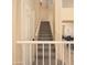 Home staircase with carpet runner and white railing at 7452 W Los Gatos Dr, Glendale, AZ 85310