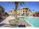 Serene pool area with palm trees, comfortable loungers, and inviting landscaping for ultimate relaxation at 7601 E Indian Bend Rd # 3057, Scottsdale, AZ 85250